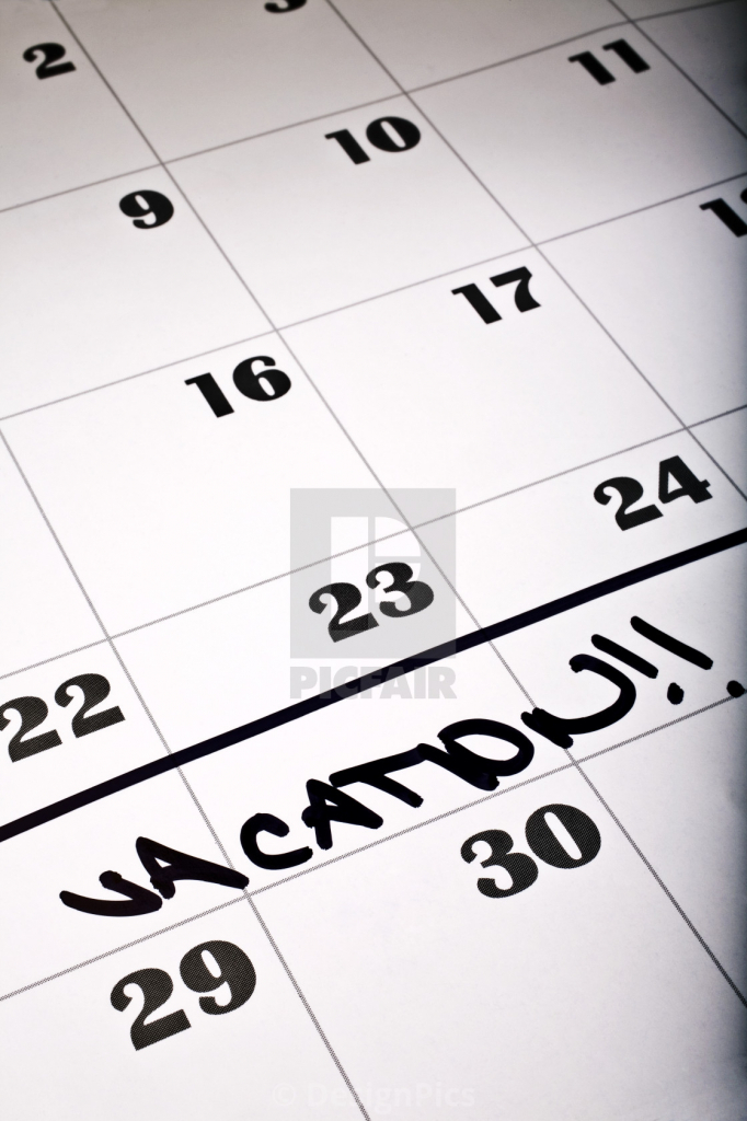 detail of a calendar page with the word vacation license print black out schedule for vacation